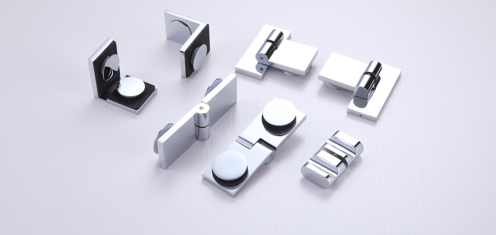 Types of shower door hardware available at King Hardware, such as full sliding shower door systems, frameless double sliding shower doors, wall mount hinges , glass to glass hinges, pull handles and support bars.